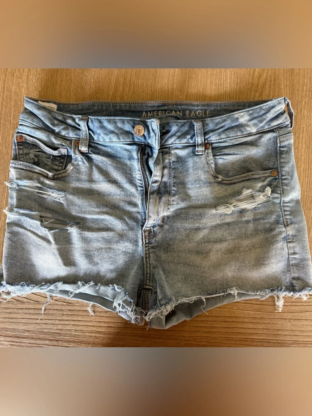 American Eagle Next Level Stretch High Waist Light Wash Denim Cutoff Shorts - Picture 6 of 6